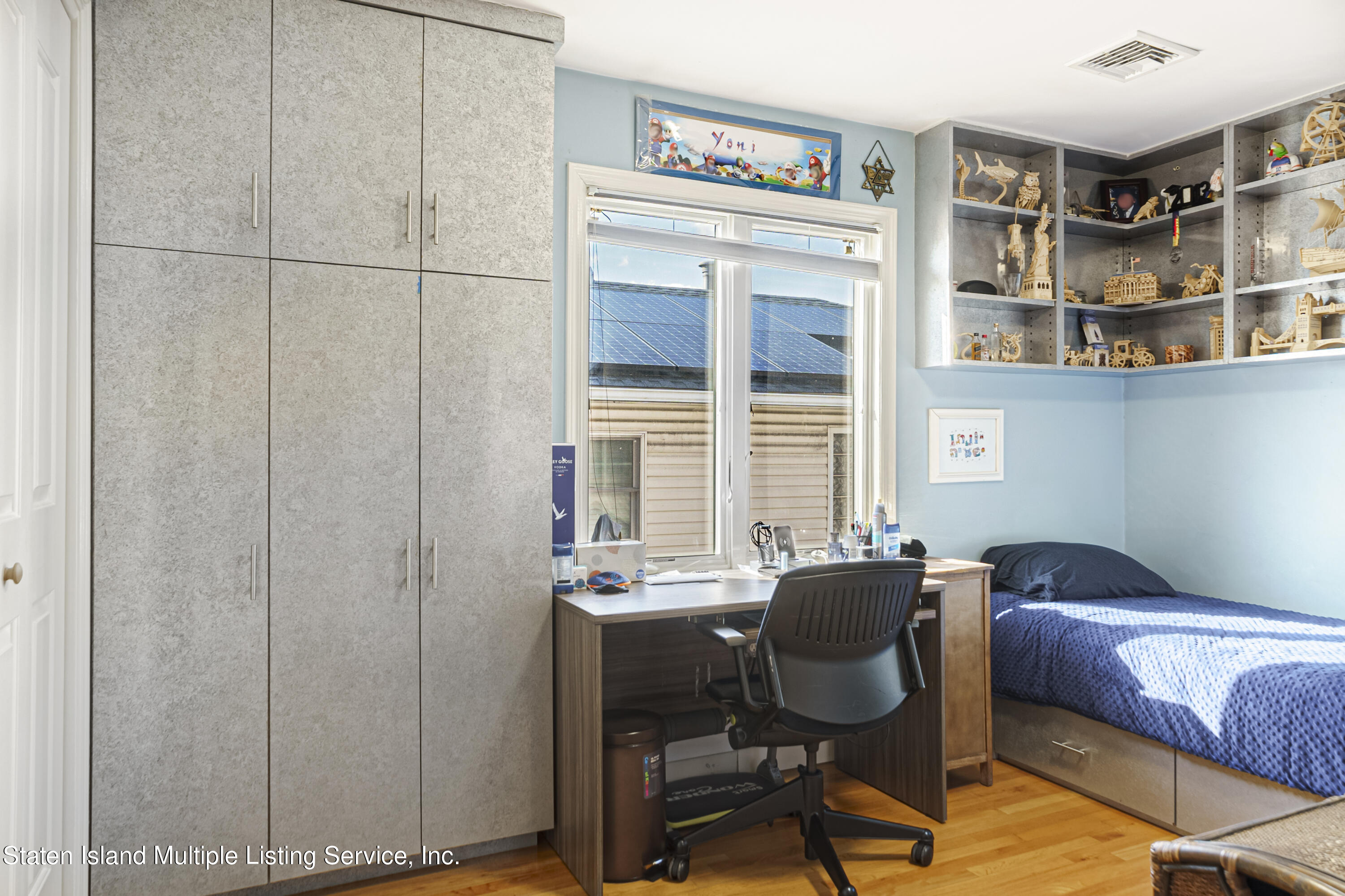 19 Bascom Place Staten Island, NY 10314 - Photo 26 of 54 a view of a workspace with furniture and a window