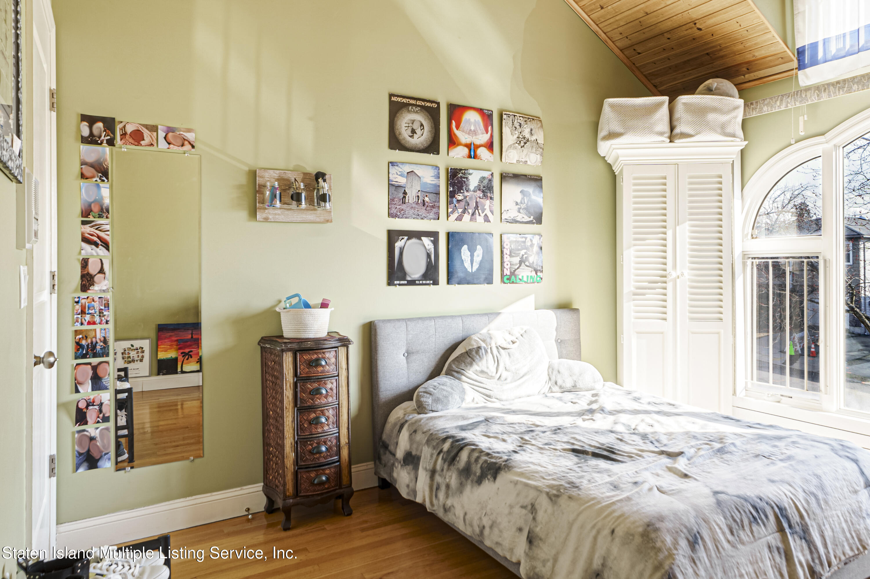 19 Bascom Place Staten Island, NY 10314 - Photo 29 of 54 a bed sitting in a bedroom next to a window