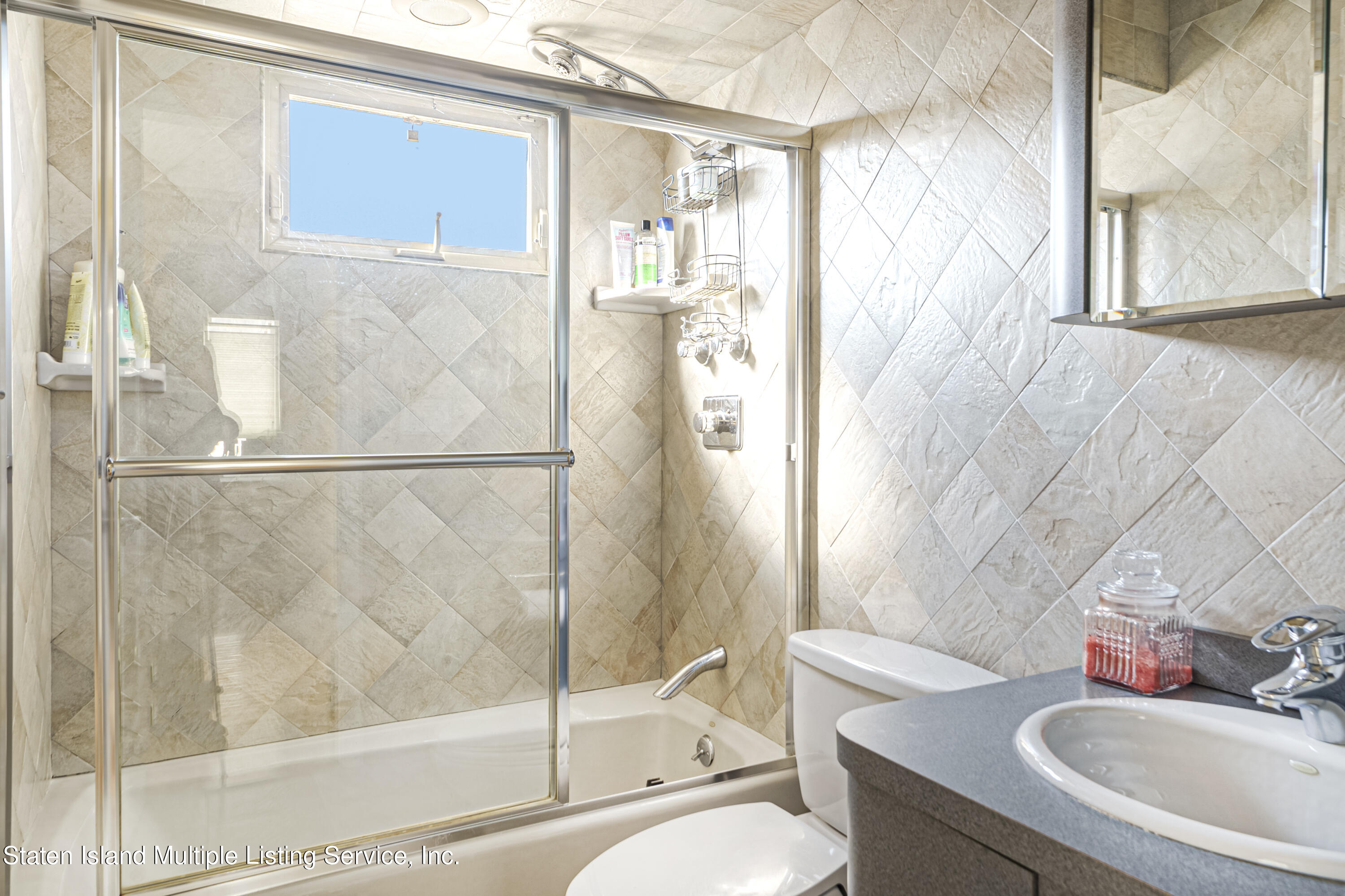 19 Bascom Place Staten Island, NY 10314 - Photo 33 of 54 a bathroom with a granite countertop sink toilet and shower