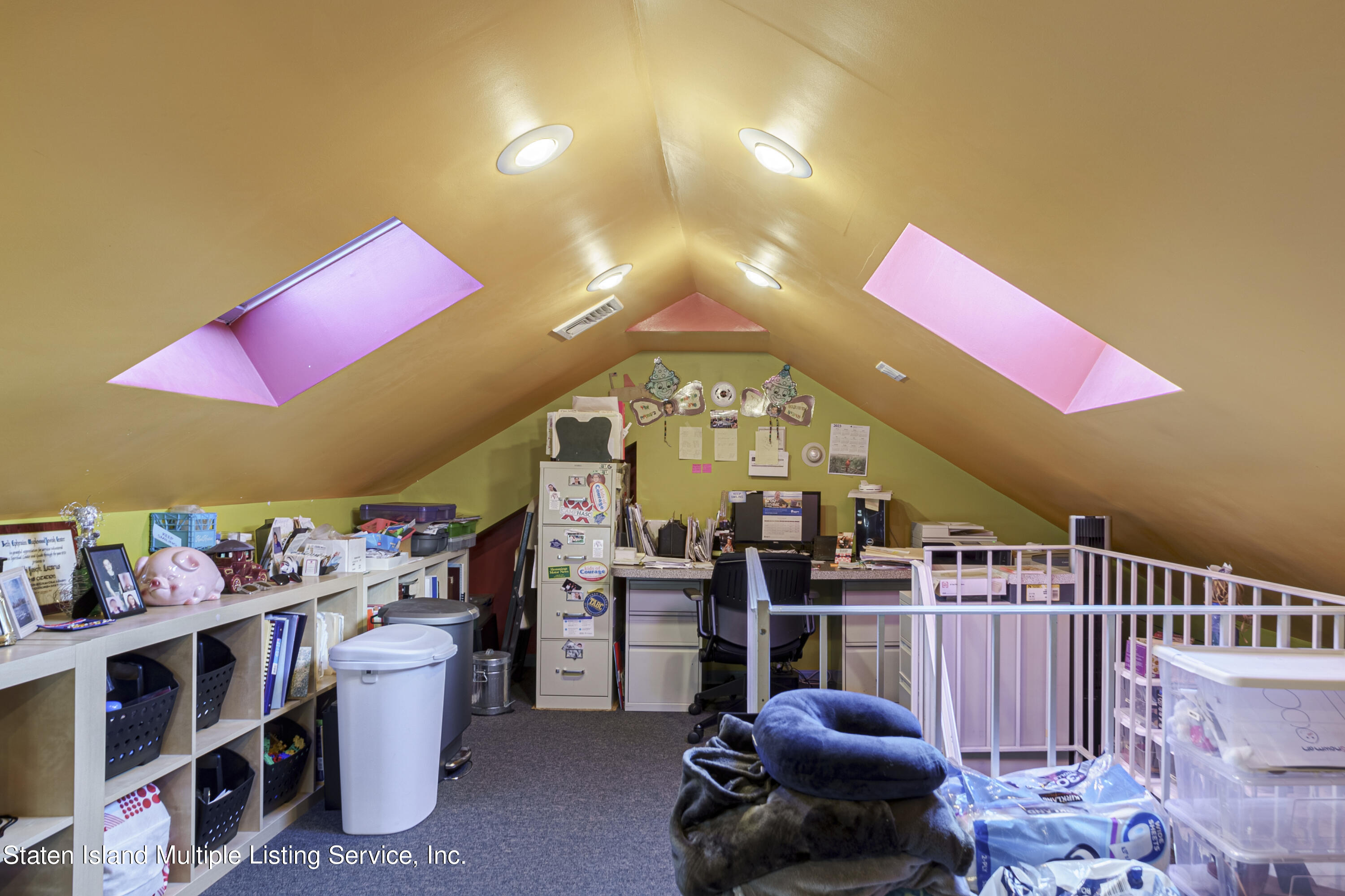 19 Bascom Place Staten Island, NY 10314 - Photo 37 of 54 a room with lots of furniture and clutter
