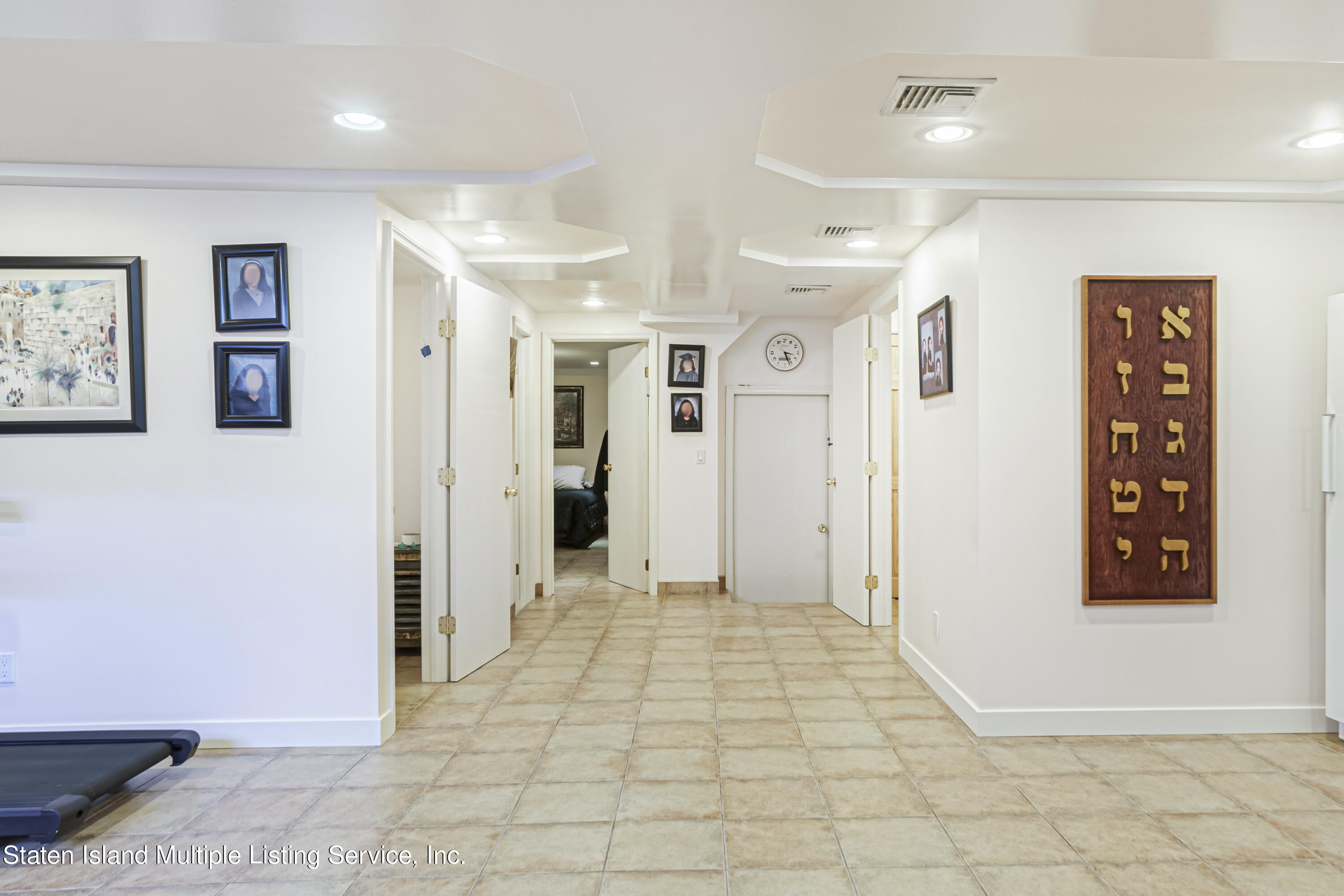 19 Bascom Place Staten Island, NY 10314 - Photo 38 of 54 a view of a hallway with wooden shelves