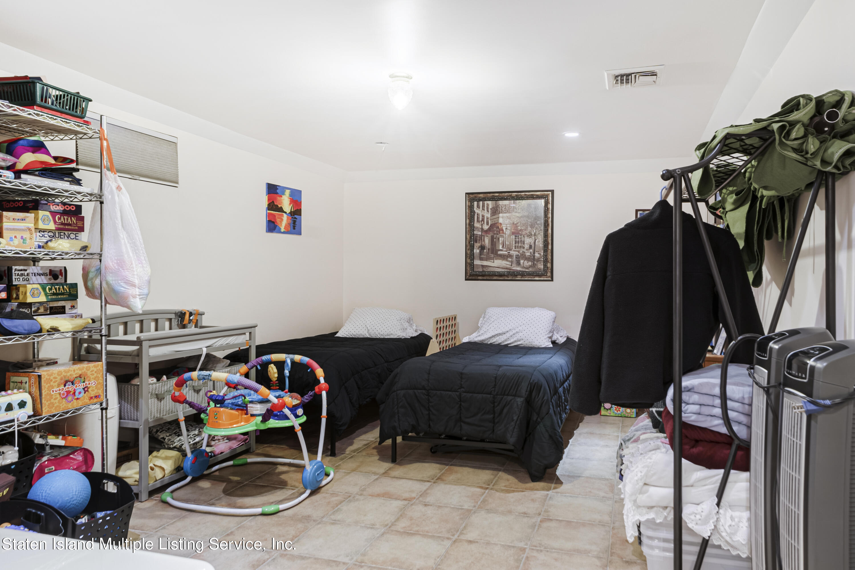 19 Bascom Place Staten Island, NY 10314 - Photo 42 of 54 a bedroom with furniture and a closet