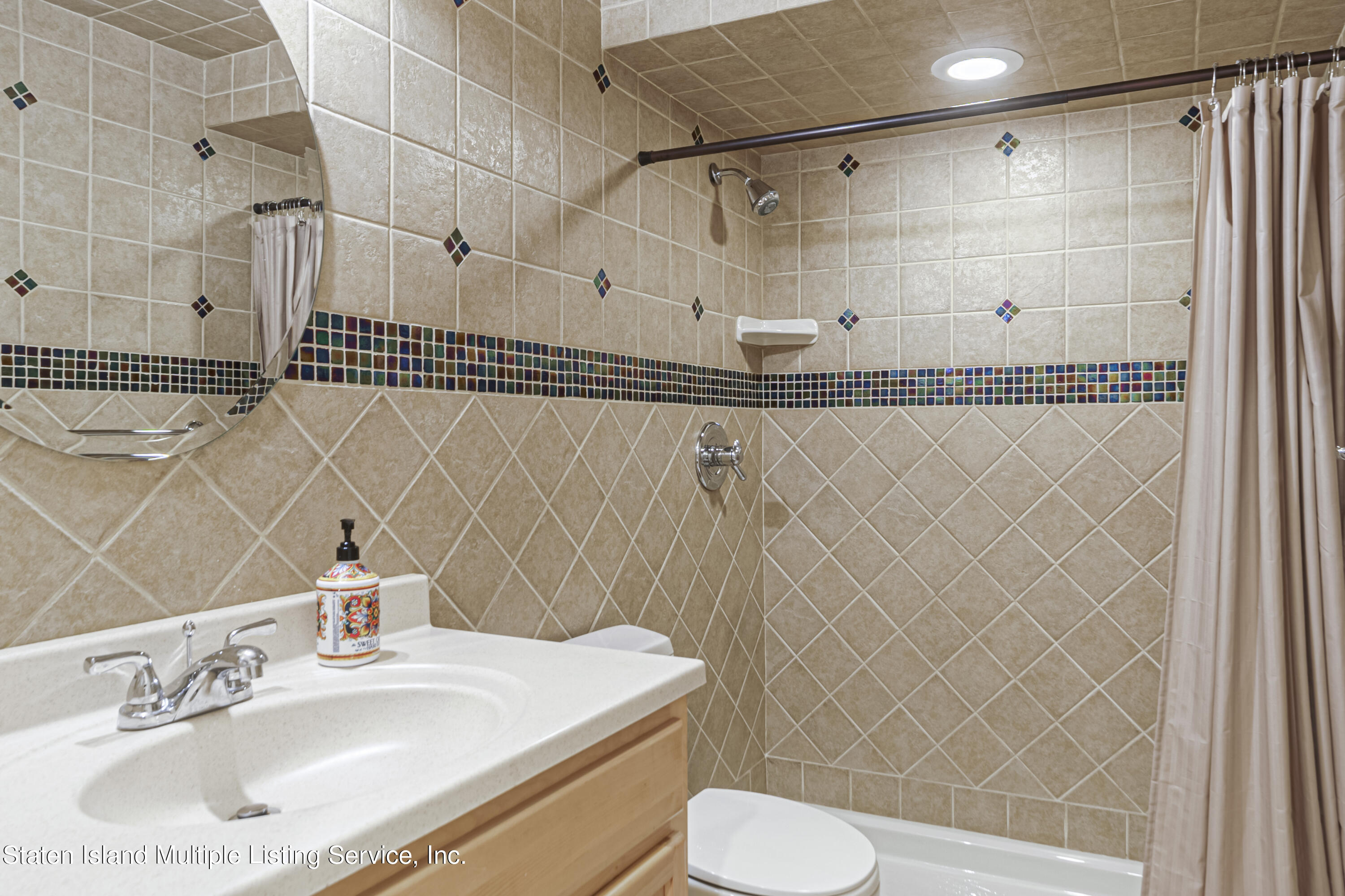 19 Bascom Place Staten Island, NY 10314 - Photo 44 of 54 a bathroom with a sink toilet and shower