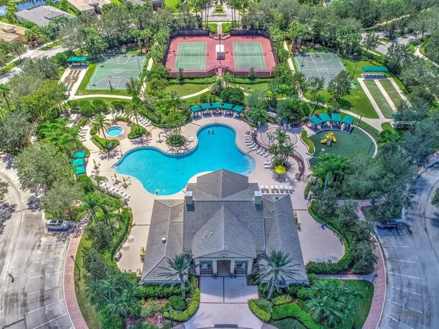 an aerial view of house with yard swimming pool and outdoor seating