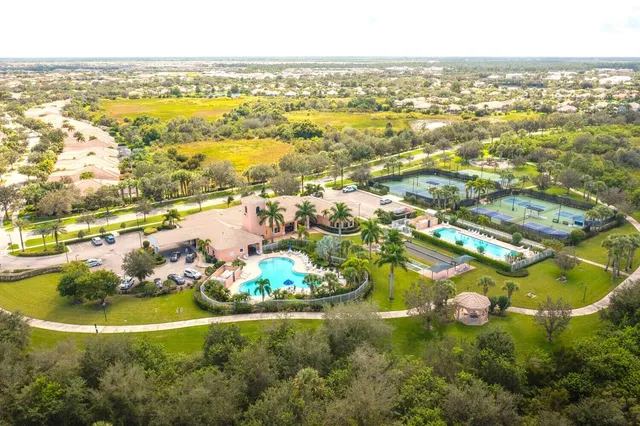 an aerial view of ocean residential houses with outdoor space and swimming pool
