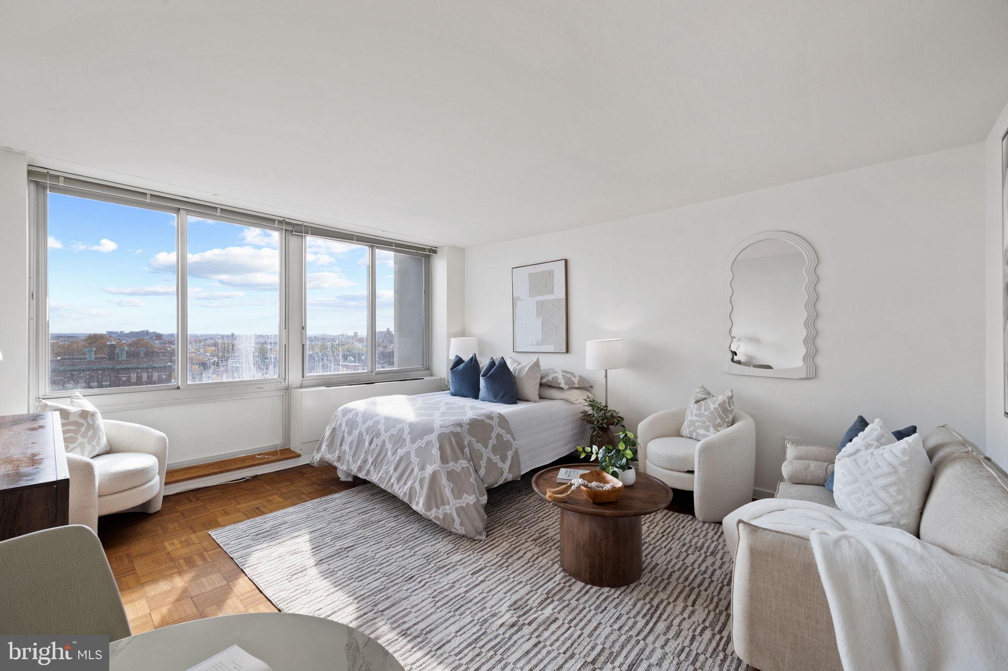 604 South Washington Square, Unit 913 Philadelphia, PA 19106 - Photo 2 of 24 a bedroom with furniture and a large window