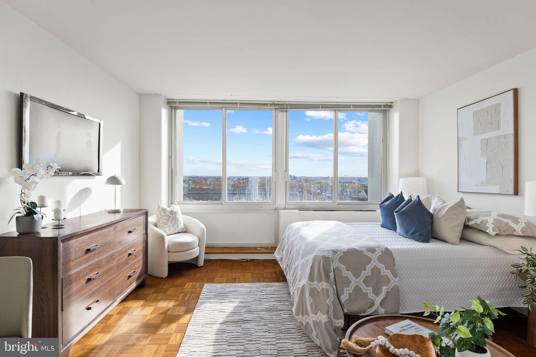 604 South Washington Square, Unit 913 Philadelphia, PA 19106 - Photo 3 of 24 a bedroom with bed and a large window