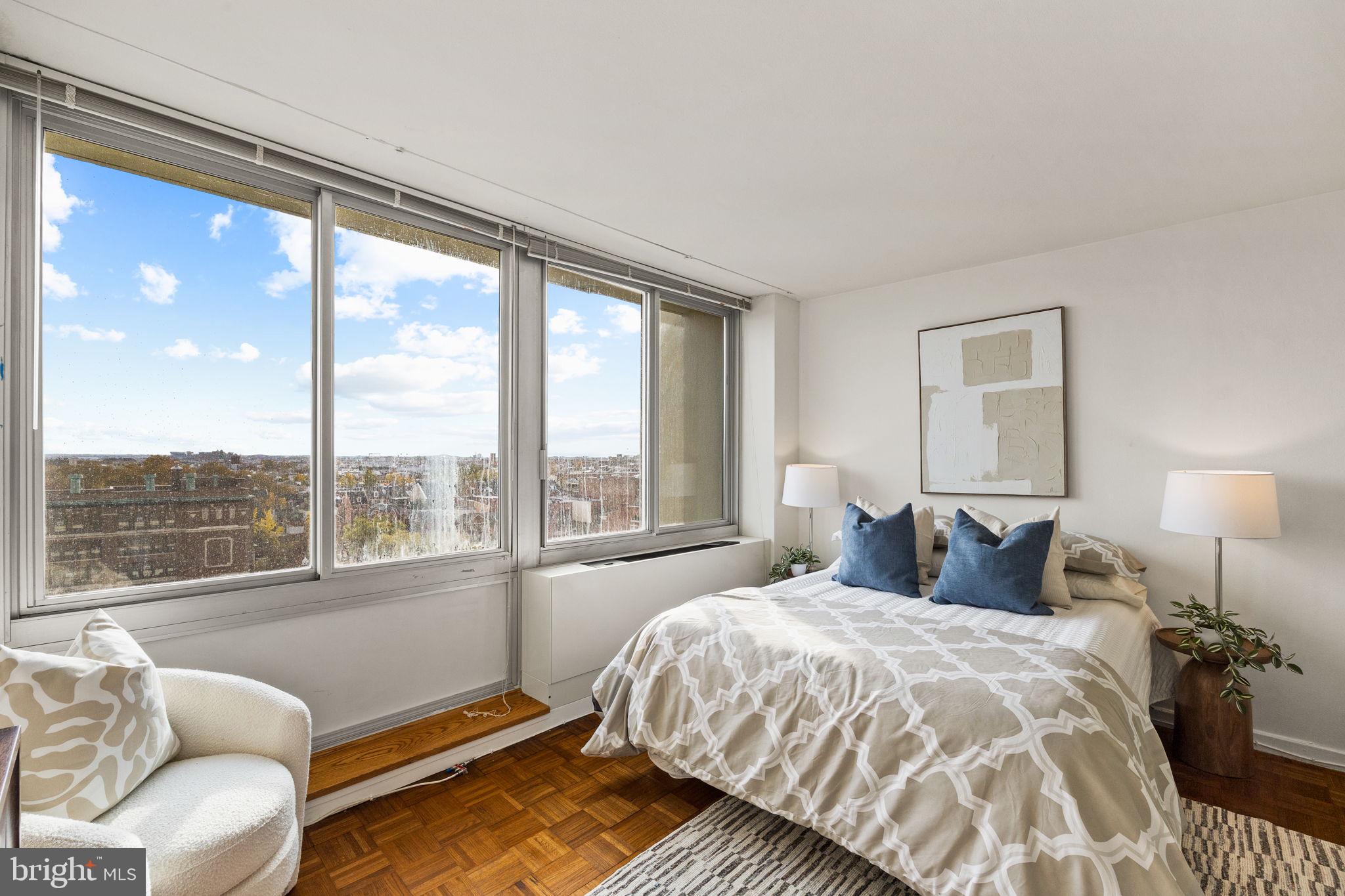 604 South Washington Square, Unit 913 Philadelphia, PA 19106 - Photo 4 of 24 a bedroom with a bed and a large window