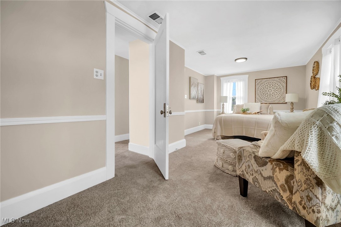 404 Niles Vienna Road Vienna, OH 44473 - Photo 24 of 48 Bedroom with light colored carpet, visible vents, and baseboards