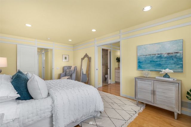 a bedroom with a bed and a cabinets