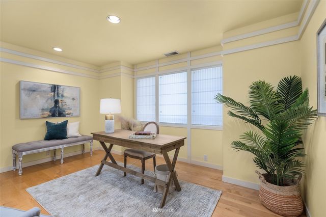 a view of a livingroom with furniture and a potted plant