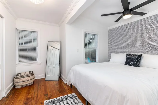 a bedroom with a bed and a chair