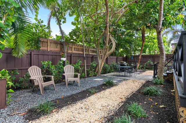 a view of a chairs and table in the patio