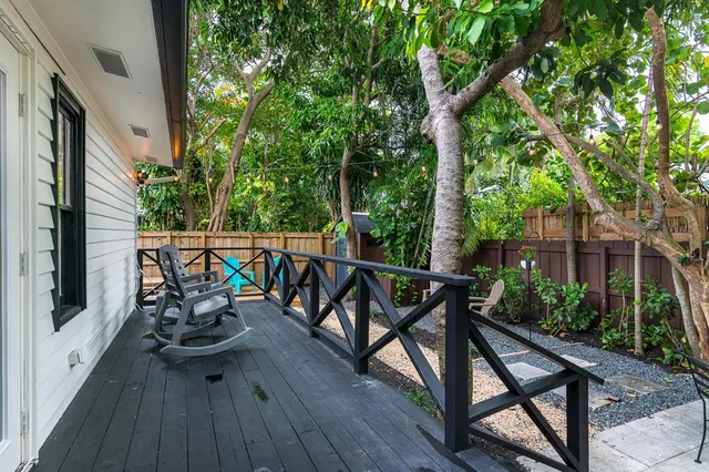 a view of a wooden deck with furniture