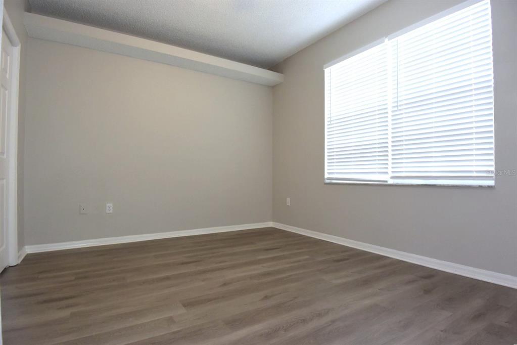 2339 Renton Lane Spring Hill, FL 34609 - Photo 22 of 35 wooden floor in an empty room with a window