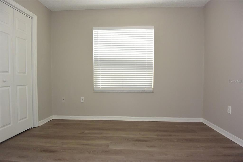 2339 Renton Lane Spring Hill, FL 34609 - Photo 23 of 35 a view of a small space with wooden floor and a window