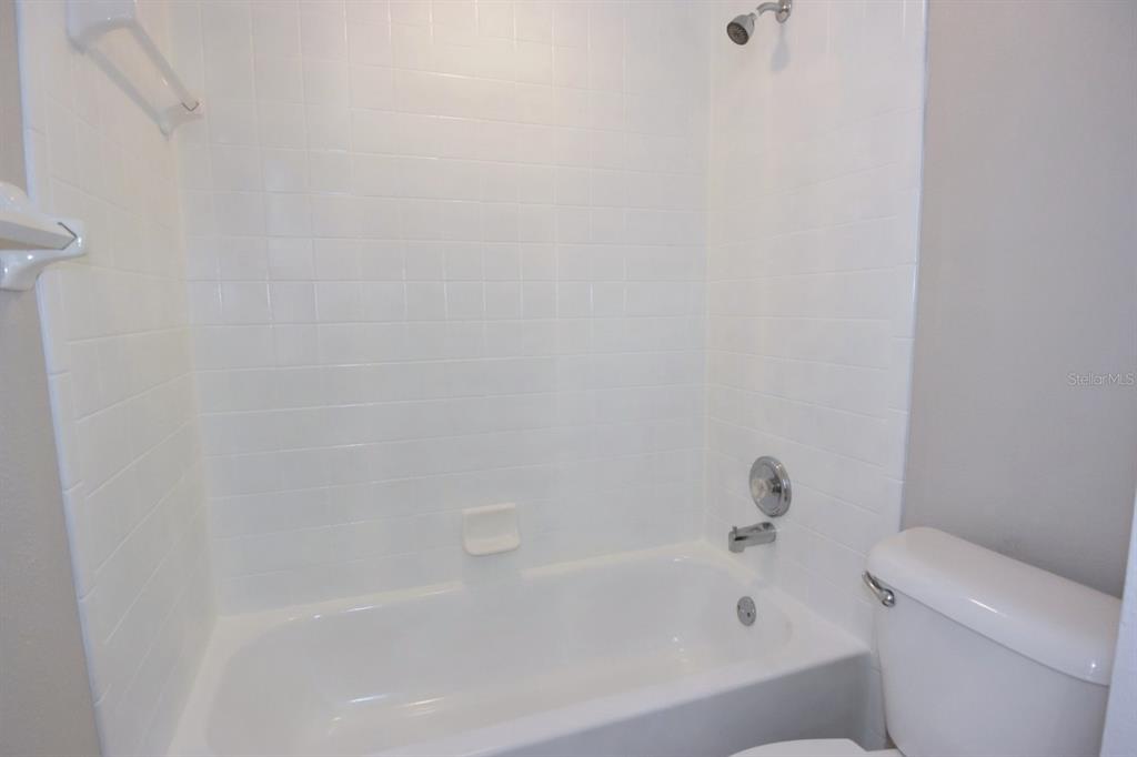 2339 Renton Lane Spring Hill, FL 34609 - Photo 25 of 35 a bathroom with a bathtub
