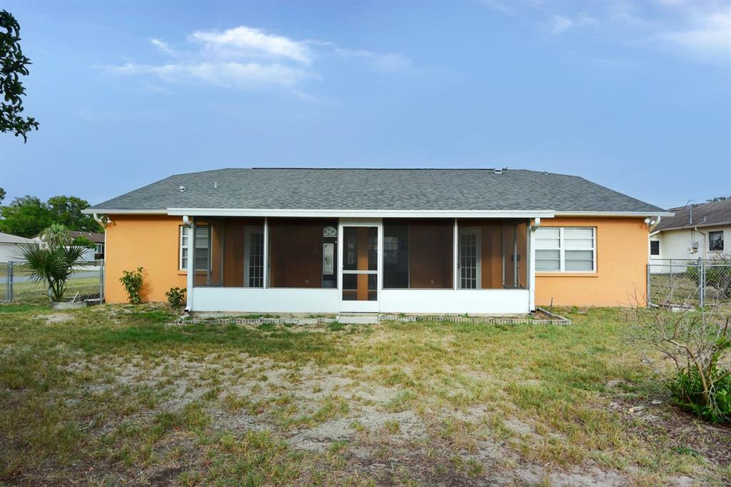 2339 Renton Lane Spring Hill, FL 34609 - Photo 30 of 35 front view of a house with a garden