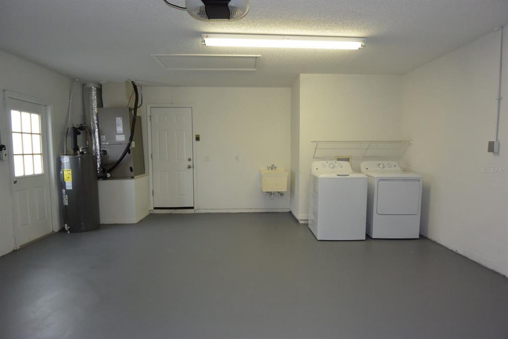 2339 Renton Lane Spring Hill, FL 34609 - Photo 34 of 35 a utility room with dryer and washer