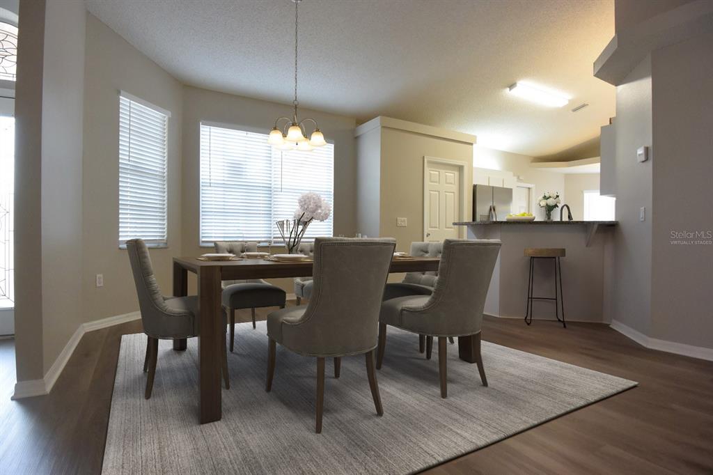 2339 Renton Lane Spring Hill, FL 34609 - Photo 7 of 35 a view of a dining room with furniture and window