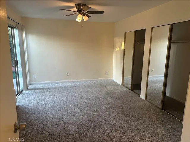 an empty room with a mirror