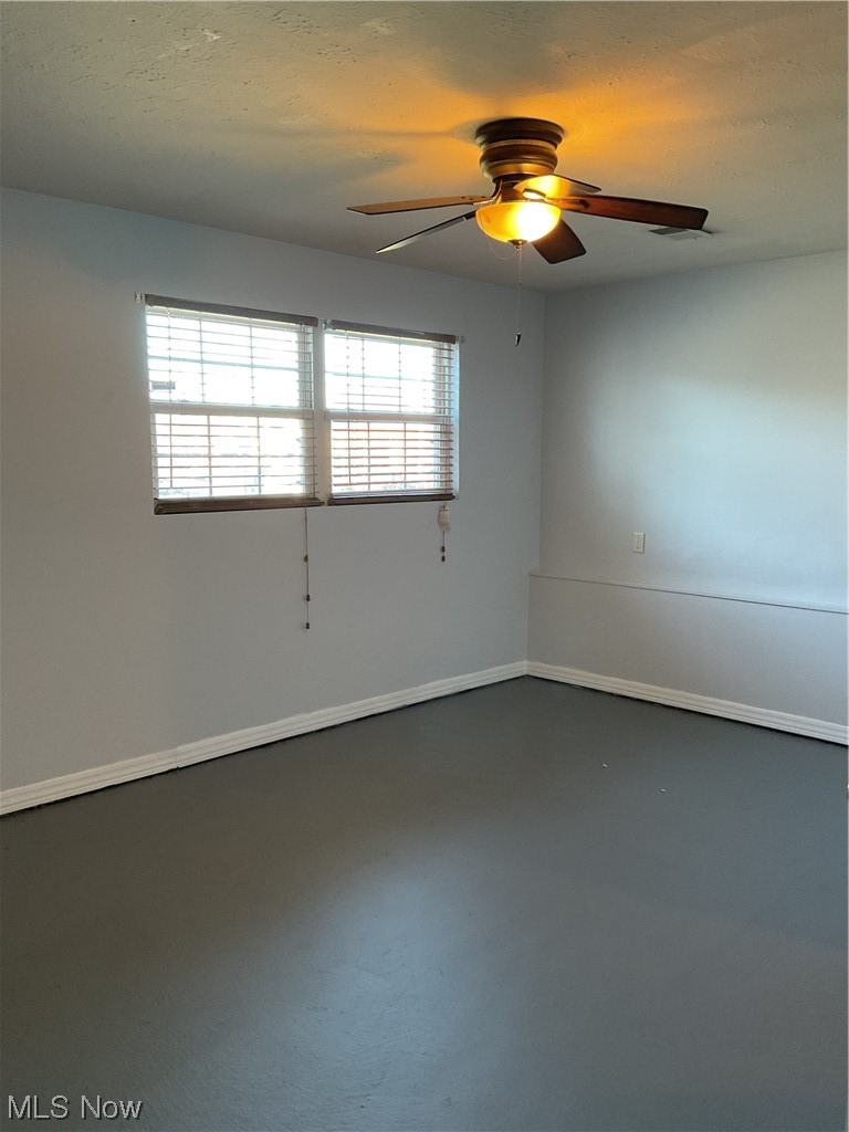 4422 Sexton Road Cleveland, OH 44105 - Photo 22 of 30 Unfurnished room with concrete floors and ceiling fan