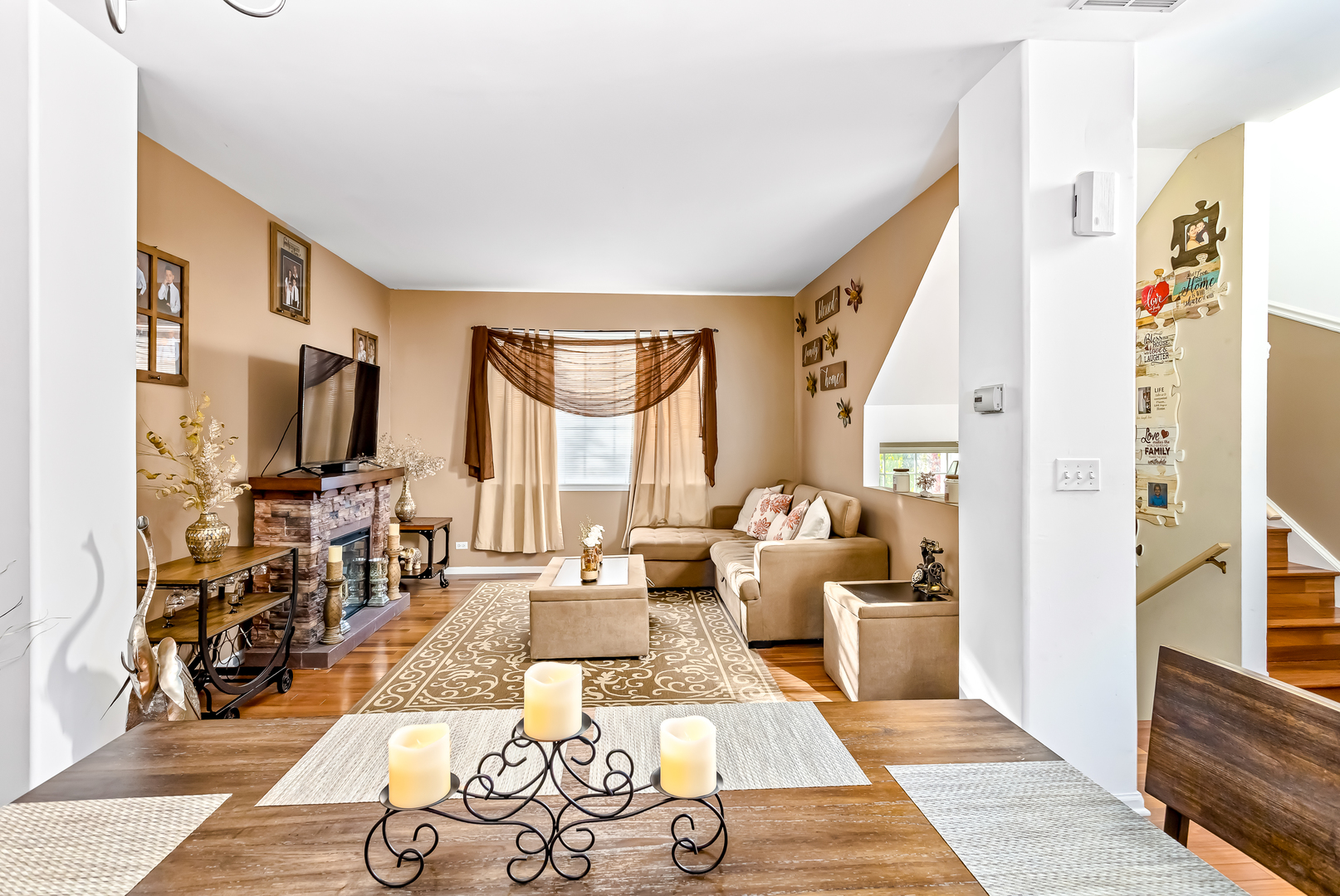 3389 Ravinia Circle, Unit 3389 Aurora, IL 60504 - Photo 3 of 23 a living room with furniture fireplace and a table