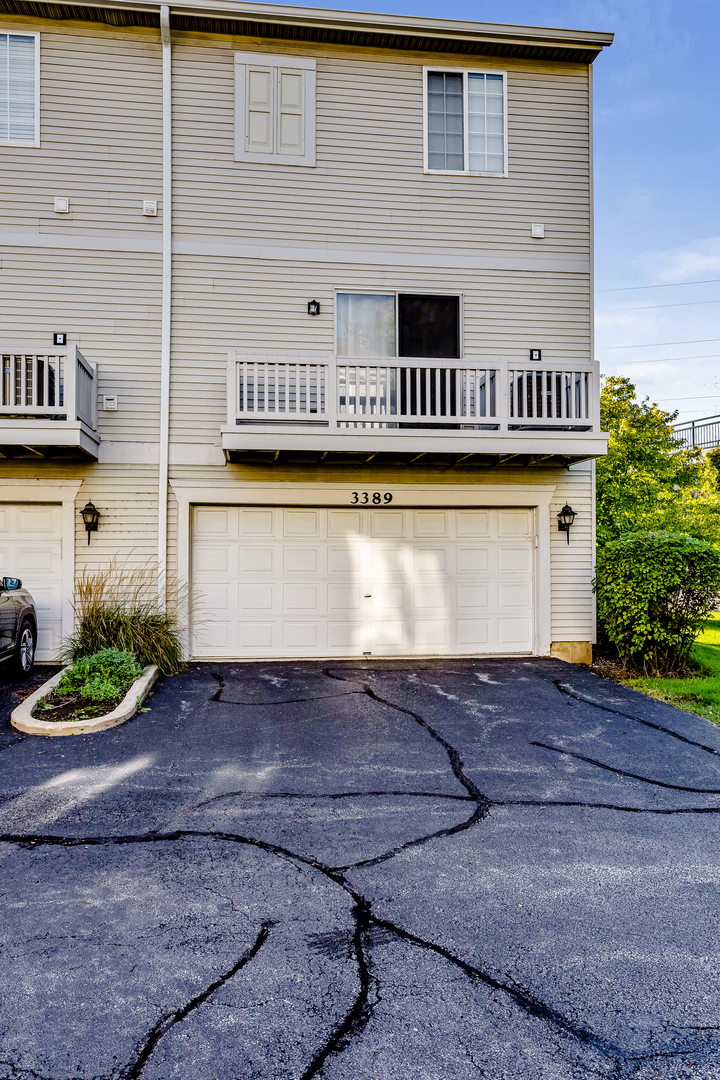 3389 Ravinia Circle, Unit 3389 Aurora, IL 60504 - Photo 23 of 23 a view of a house with a street