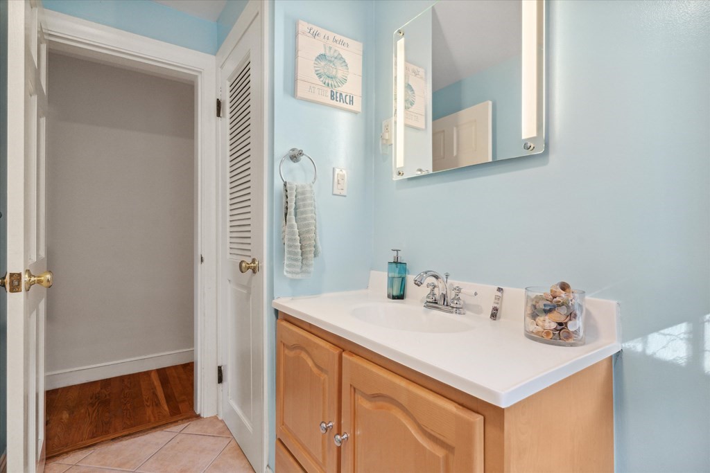 13 Surrey Road Salem, MA 01970 - Photo 16 of 42 a bathroom with a sink and a mirror
