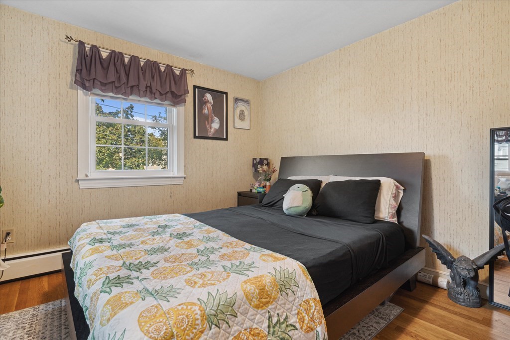 13 Surrey Road Salem, MA 01970 - Photo 17 of 42 a bedroom with a large bed and a window