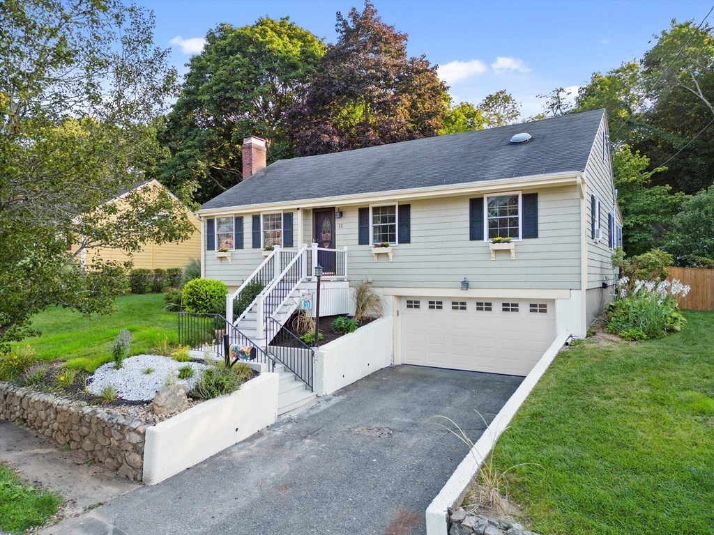 13 Surrey Road Salem, MA 01970 - Photo 2 of 42 a front view of a house with a yard