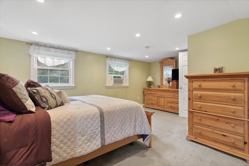 13 Surrey Road Salem, MA 01970 - Photo 21 of 42 a bedroom with a bed and a dresser