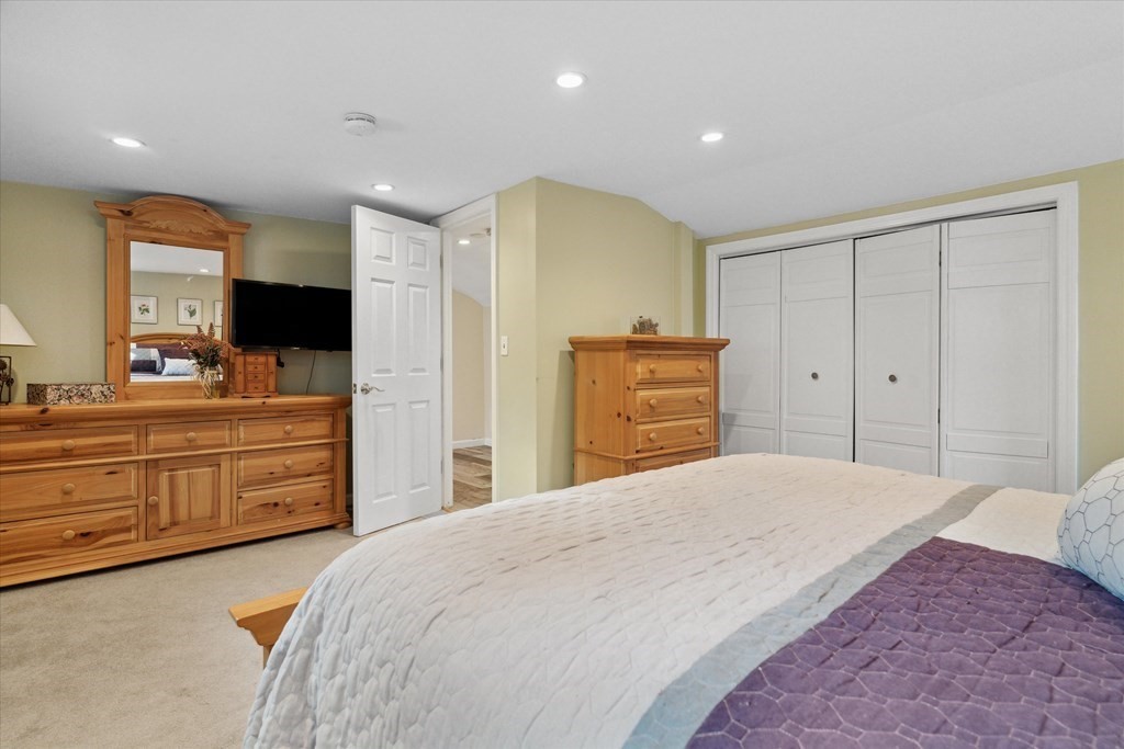 13 Surrey Road Salem, MA 01970 - Photo 22 of 42 a spacious bedroom with a large bed and a dresser