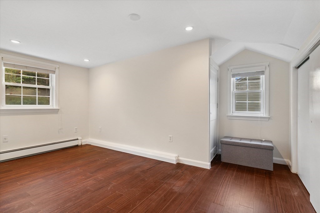 13 Surrey Road Salem, MA 01970 - Photo 25 of 42 an empty room with wooden floor and windows