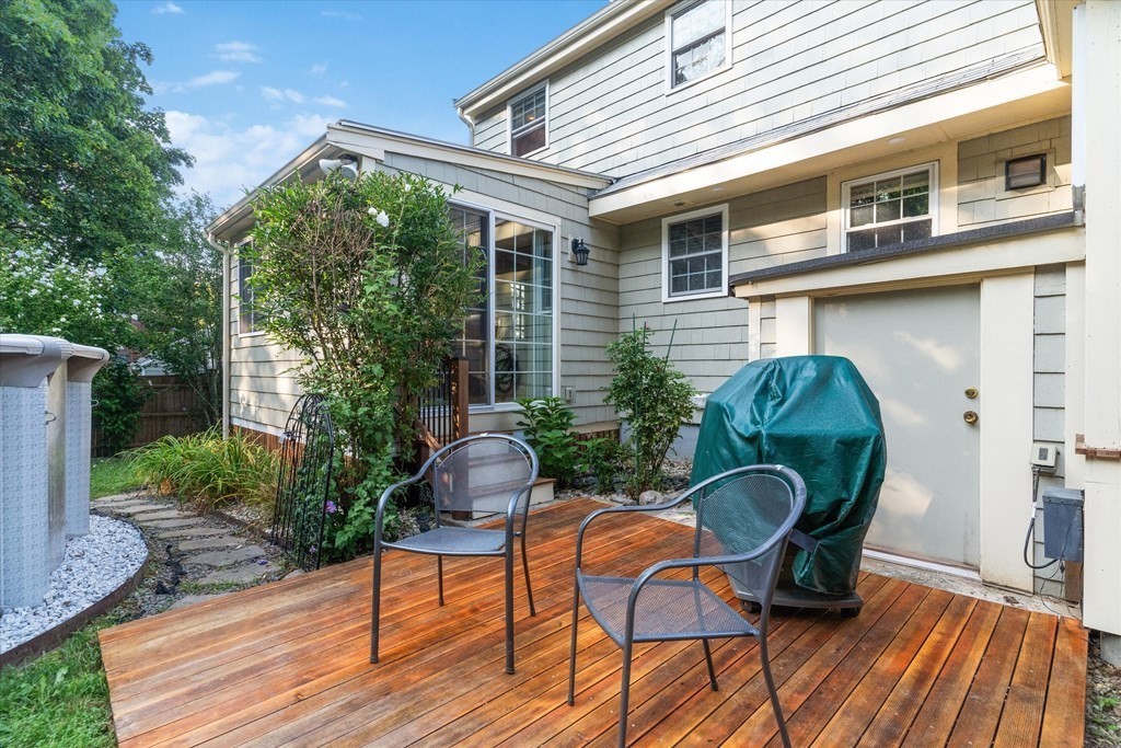 13 Surrey Road Salem, MA 01970 - Photo 30 of 42 a patio with table and chairs and potted plants