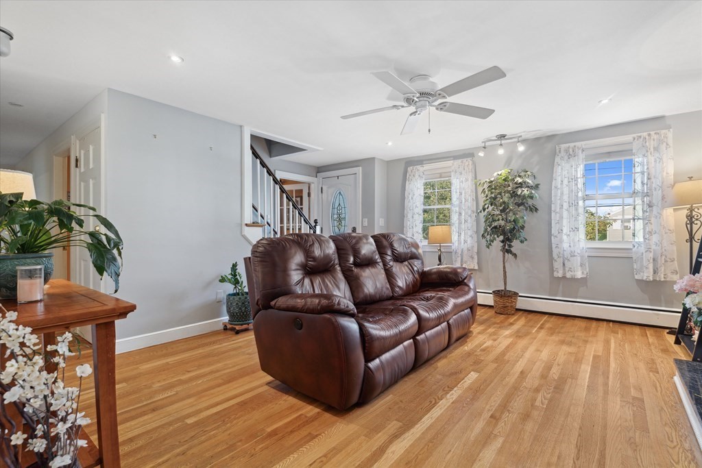 13 Surrey Road Salem, MA 01970 - Photo 4 of 42 a living room with furniture and a wooden floor