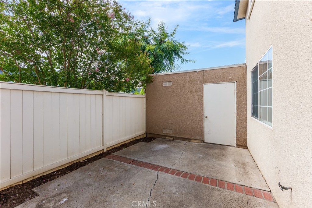 19111 Hamlin Street Reseda, CA 91335 - Photo 9 of 20 Large private patio with view towards the garage.