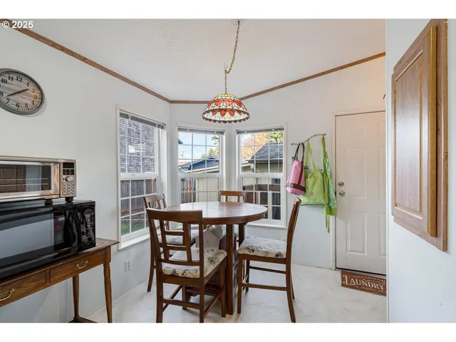 a dining room with furniture and window