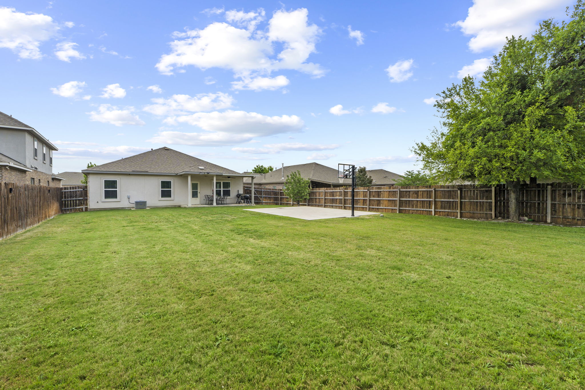 2417 Bridges Ranch Road Georgetown, TX 78628 - Photo 17 of 36 Rear view of house with a patio and a fenced backyard
