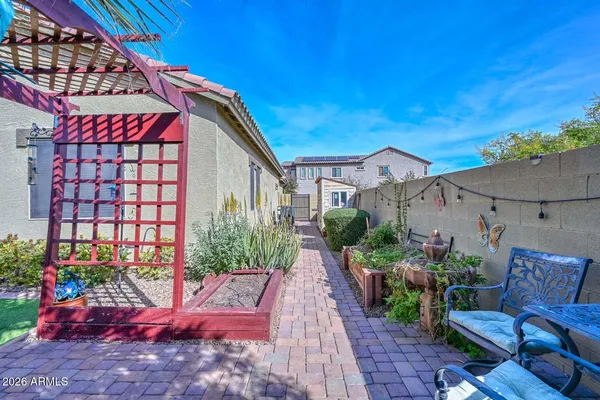 a view of yard with swimming pool and green space