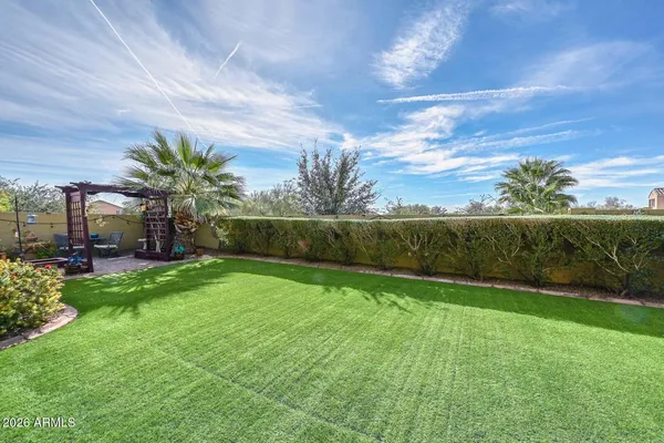 a view of yard with outdoor seating and green space