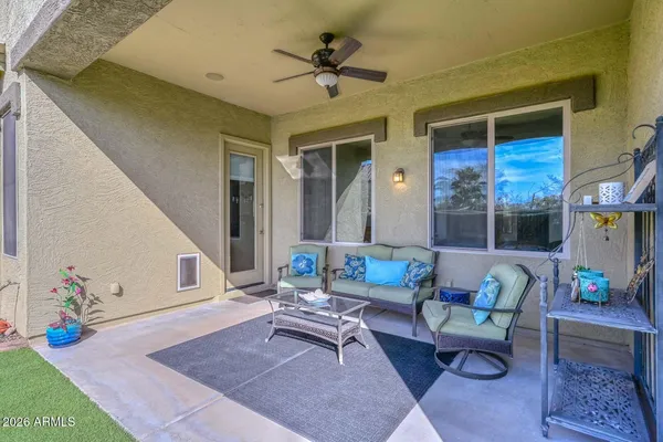 a view of a backyard with sitting area and furniture
