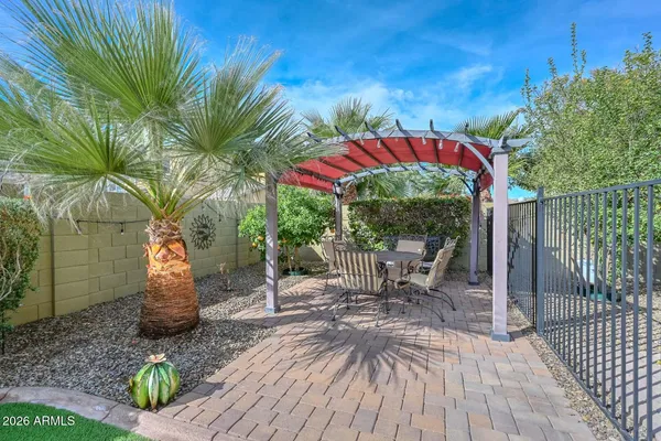 a view of a house with backyard porch and sitting area