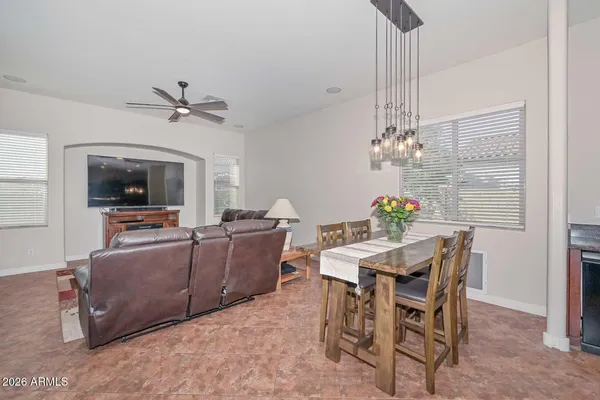 a living room with furniture and kitchen view