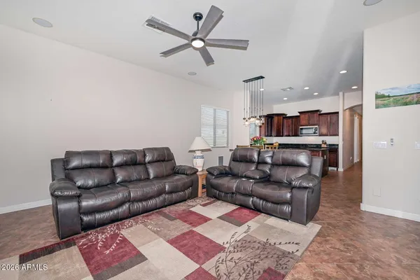 a living room with furniture and a rug