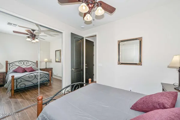 a bedroom with a bed and a dresser