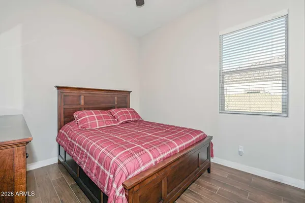 a spacious bathroom with a granite countertop sink and a mirror