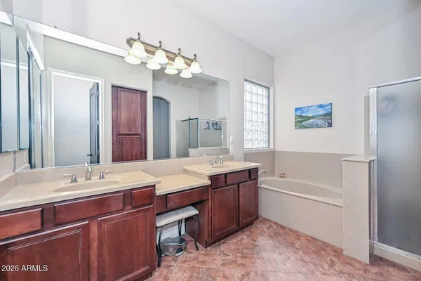 a large kitchen with a refrigerator a sink and a stove top oven