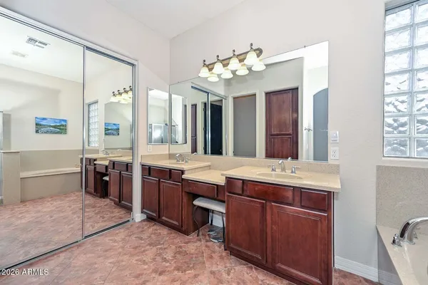 a living room with couch and a wooden floor