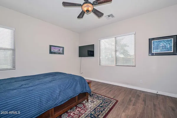 a work room with furniture and a book shelf